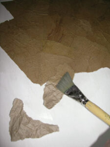 Try This: Phonebook and Recycled Paper Bag Collage Wall Treatment Image